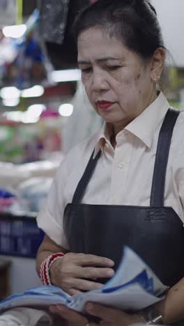 woman in apron at market