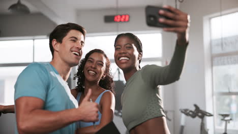 friends taking selfie at gym