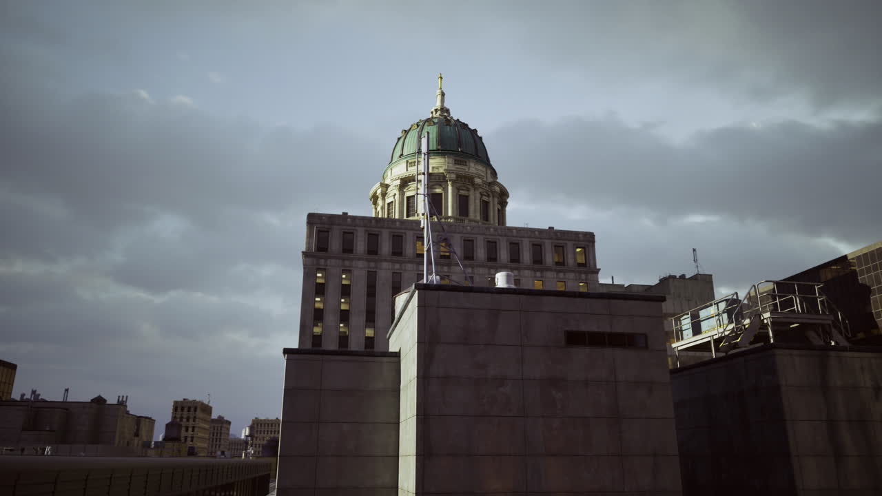 Historic building with dome shines under cloudy sky in urban landscape