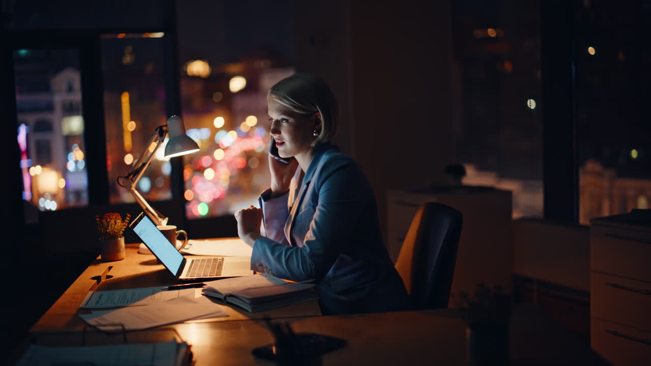Professional consultant calling evening company workspace. Busy manager talking