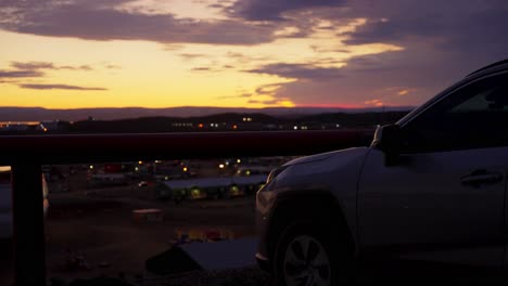 Vehicle-outline-against-northern-town-sunset