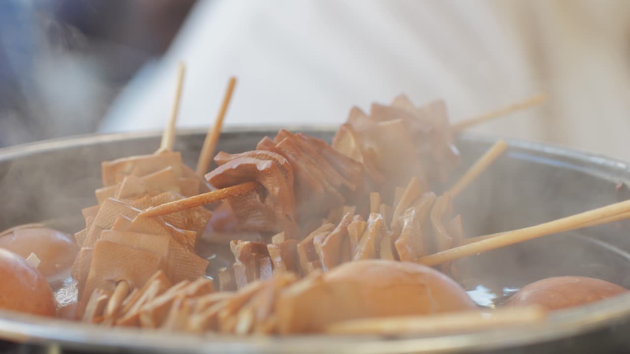 Traditional chinese spicy chicken gizzards close-up. Asian chicken stomach popular food. Local street food market outdoor. High quality 4k footage