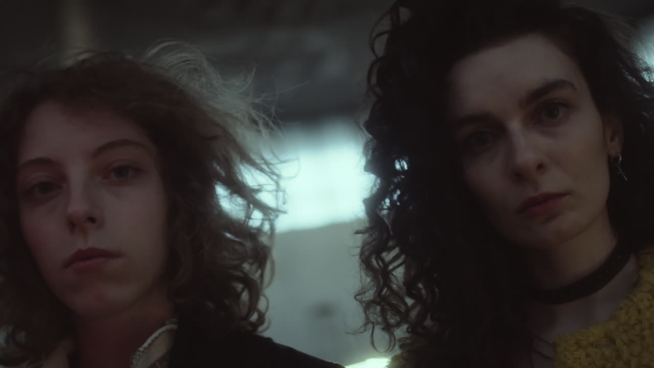 Portraits of Two Young Women with Curly Hair