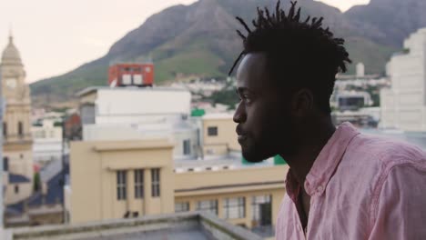 young man hanging out on a rooftop