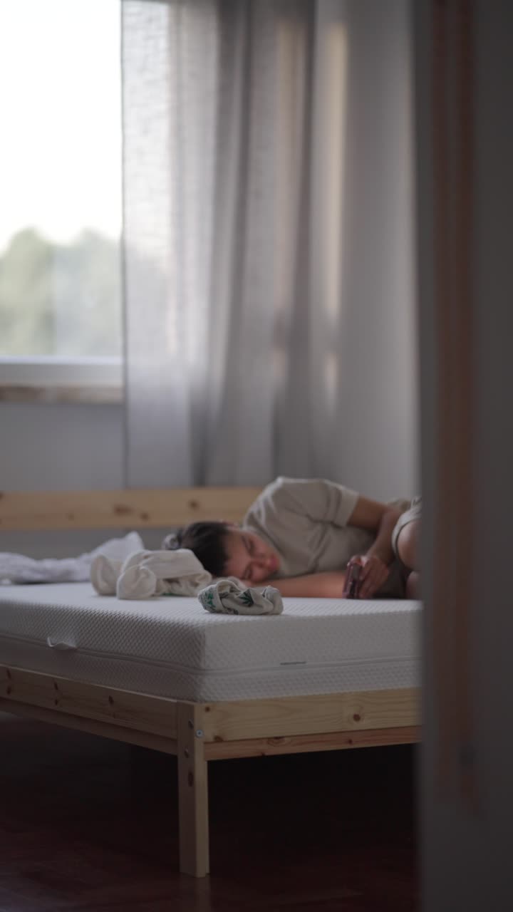 Woman Sleeping in a Bedroom