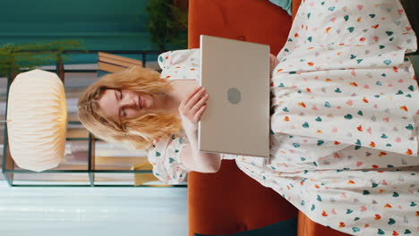 Pretty woman freelancer opens laptop starts working education sends messages makes online purchases