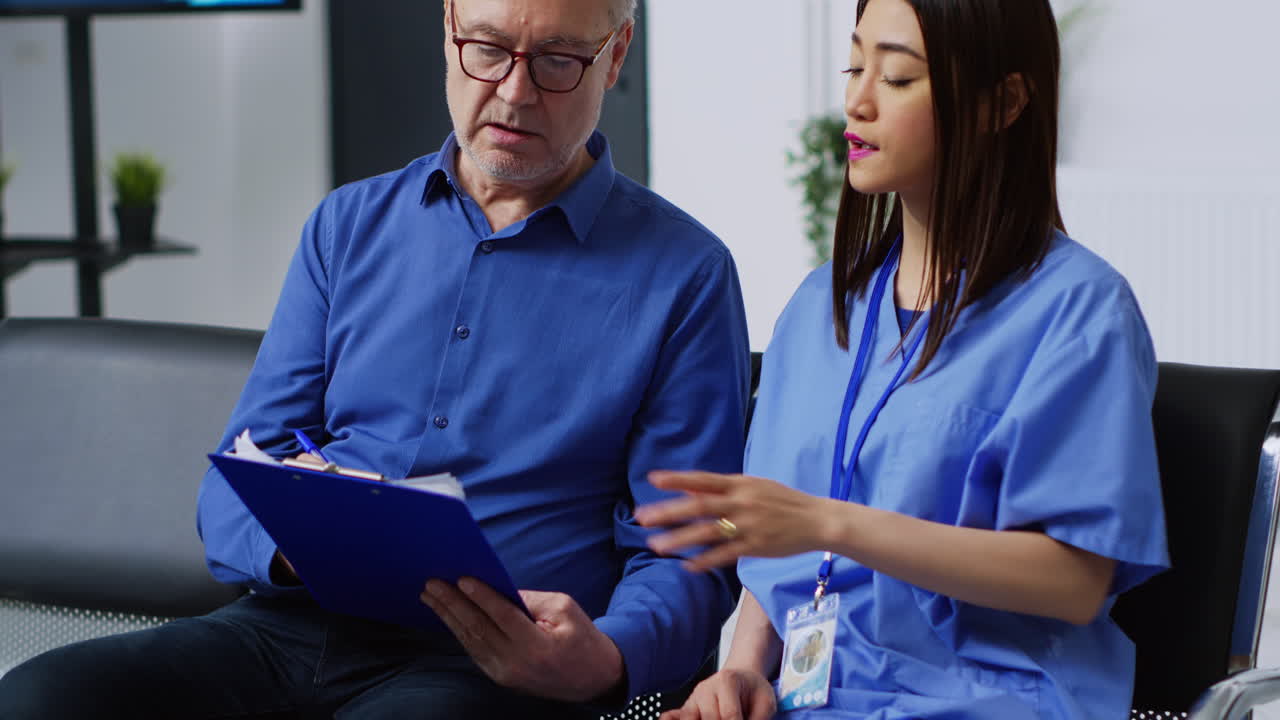 Patient consulting with nurse in waiting room