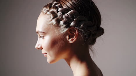 side profile of a woman with elegant braided hair