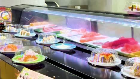 sushi plates moving on a conveyor belt