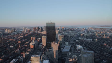 boston skyline during golden hour from the top of a sky scraper viewing deck in 4k