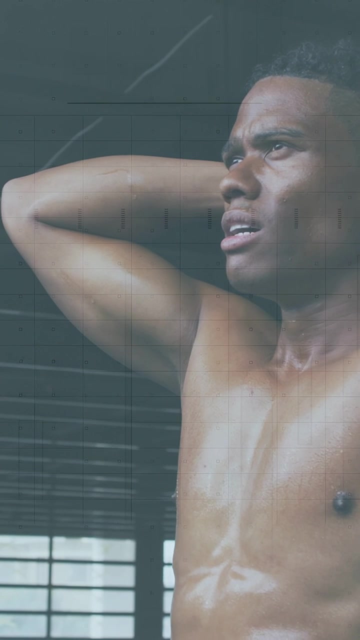 Vertical video: Post-set male fitness athlete holding head back and breathing, motion showing sweat