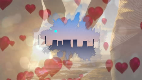 animation of light spots with hearts and cityscape over people holding hands