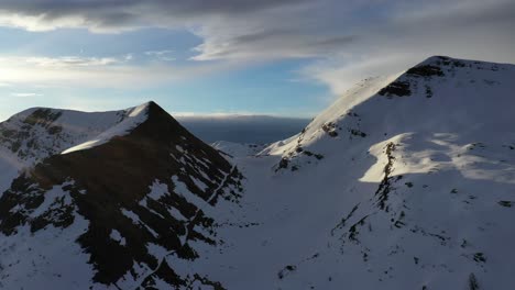 Picturesque-snow-covered-mountain-landscape-in-Italy,-remote-aerial-flight