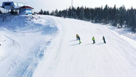 skiers and snowboarders enjoying a sunny winter day at a mountain ski resort