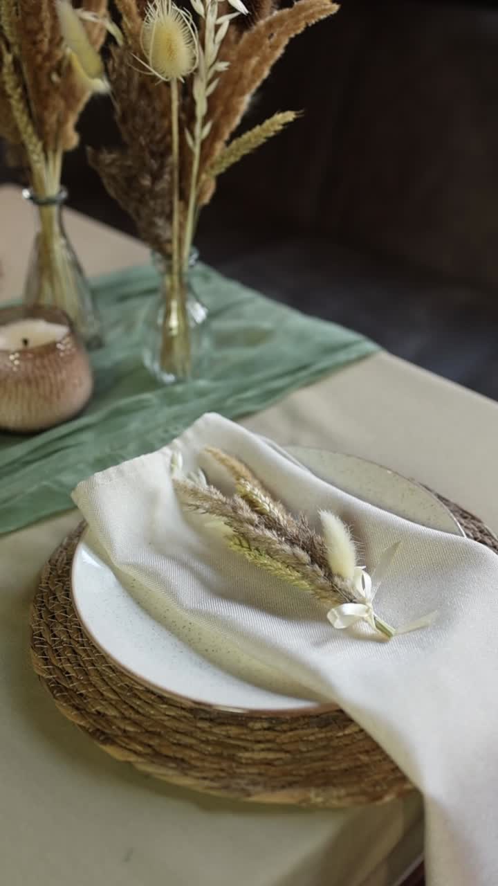 Elegant Table Setting with Dried Flowers and Rustic Decor