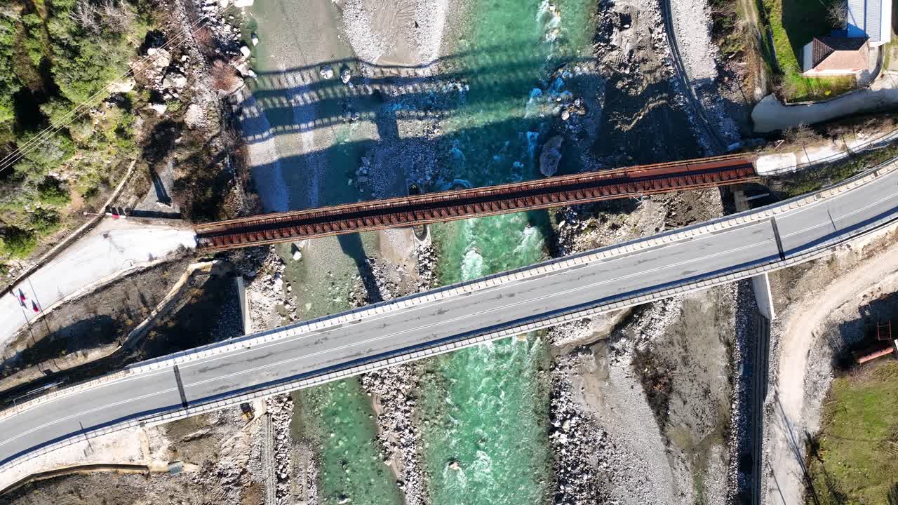 Top down aerial view of a road bridge over the river