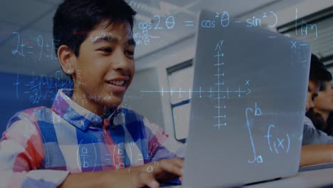 Animation-of-mathematical-equations-over-schoolboy-using-laptop-in-classroom