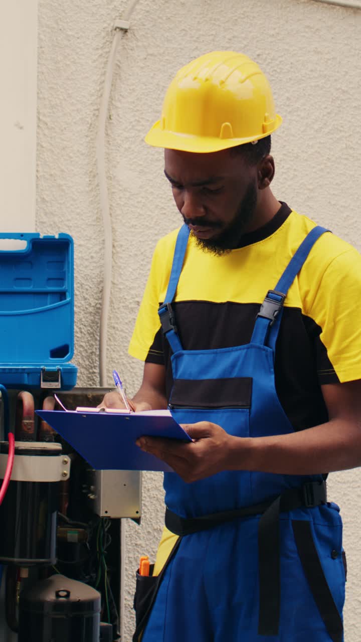 Vertical video Team working with manifold gauges