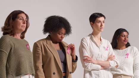 Studio-Portrait-Of-Multi-Racial-Group-Of-Women-Of-Different-Ages-Wearing-Pink-Breast-Cancer-Awareness-Ribbons-1