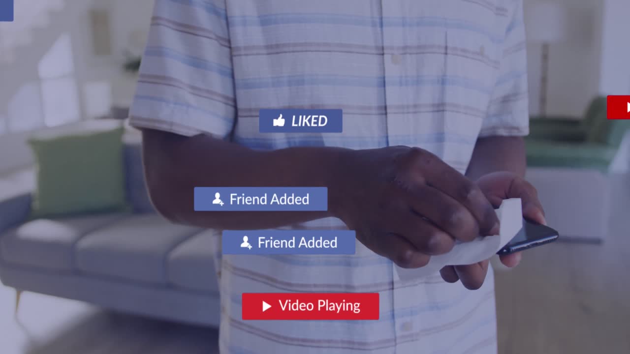 Animation of social media icons with texts over african american man cleaning smartphone