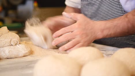 baker shaping dough for fresh bread