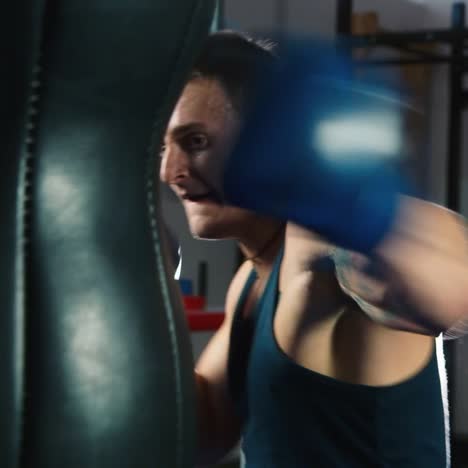 a young boxer practices punches on a punching bag 4