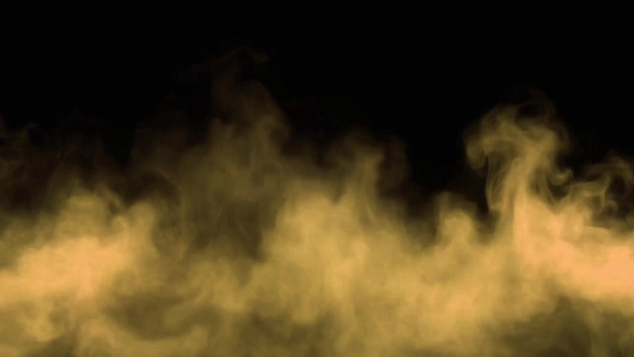 Fumo dorato che sale su sfondo nero