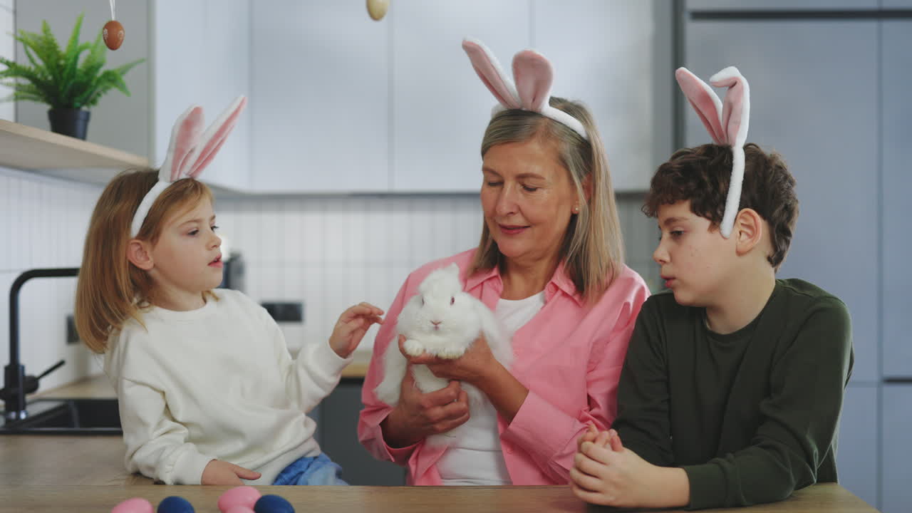 Grandparents and Grandkids Celebrate Easter in Kitchen with a White Rabbit