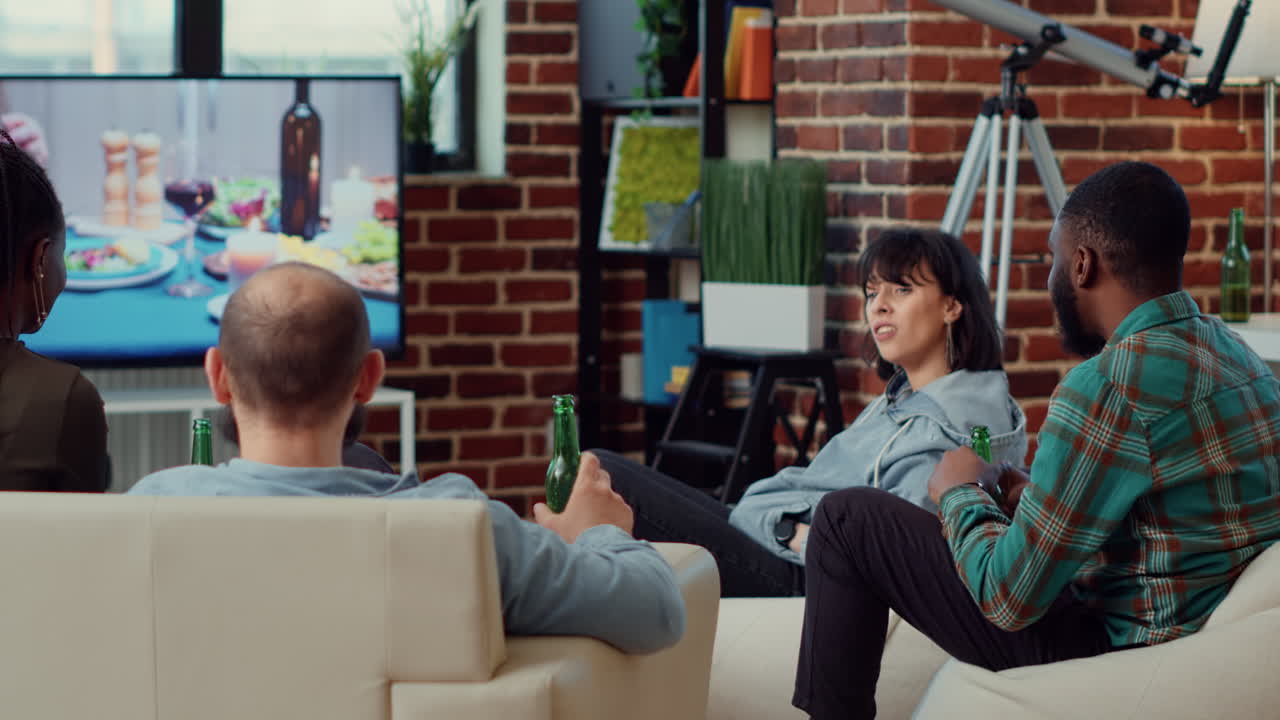 Multiethnic group of friends watching drama film on tv
