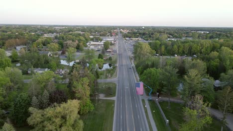 highway road and small iconic town of america, aerial drone view