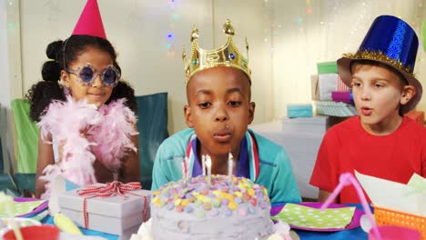 Boy-blowing-candles-on-cake-during-birthday-4k