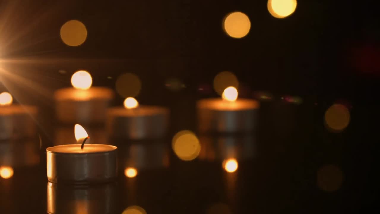 animación de velas de té encendidas y luces parpadeantes