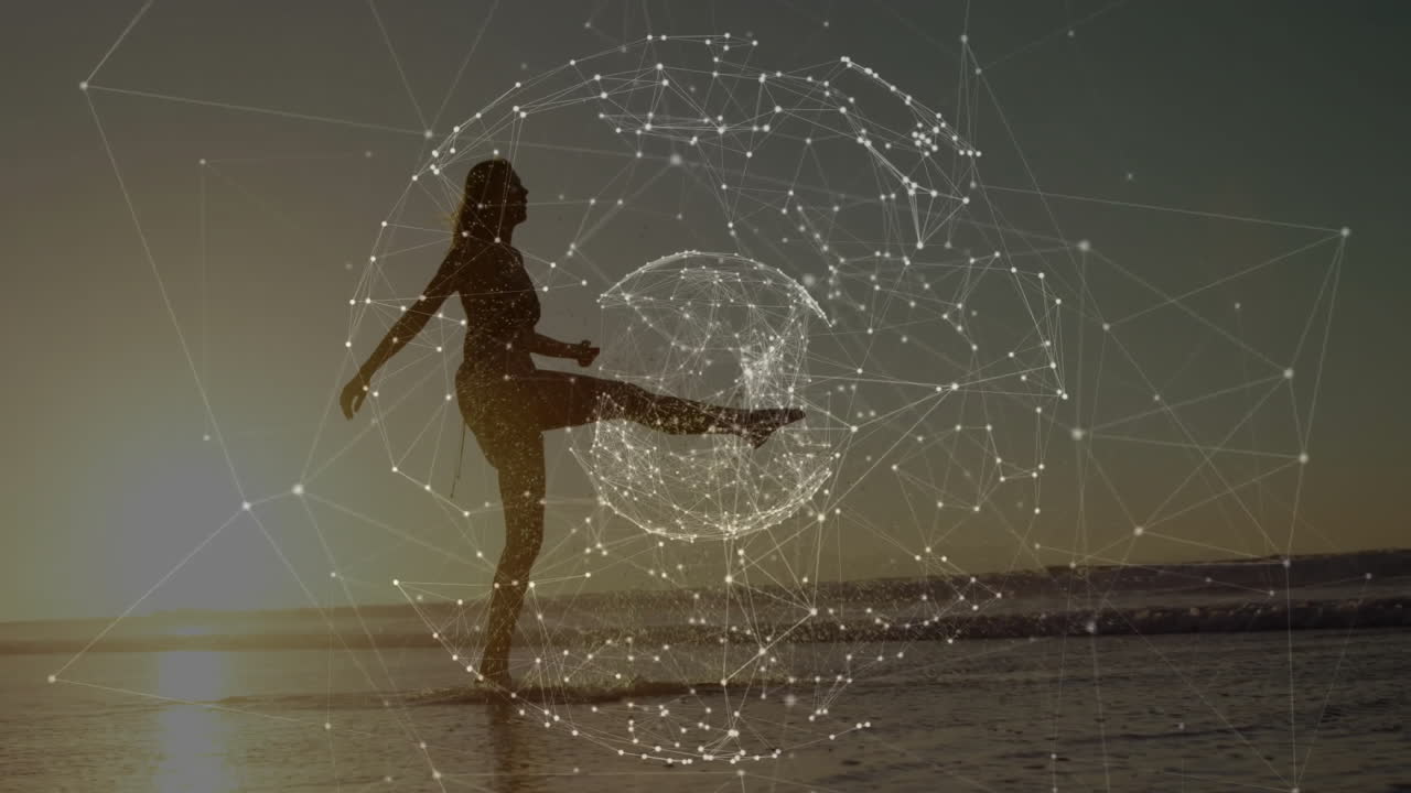 Woman kicking water droplets along sunset shoreline, featuring technology network nodes overlay