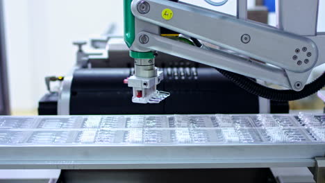 Pharmaceutical-industry.-Robotic-arm-put-ampoules-at-pharmacy-manufacturing-line