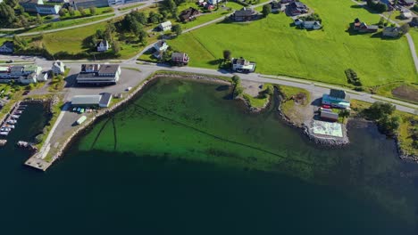 aerial over the waterfront of syvde, vanylven municipality, norway