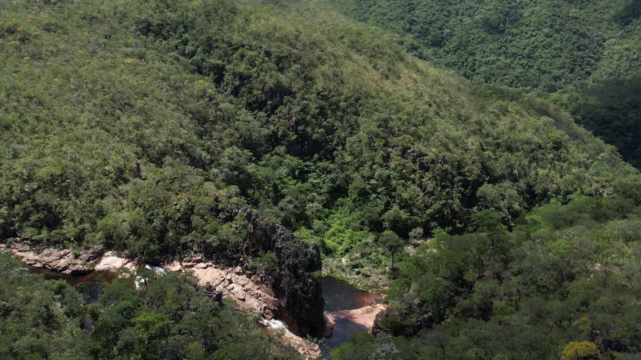aerial view village in Chapada dos Veadeiros &amp;quot;Aldeia Macaco&amp;quot; hollow-shaped bioconstruction houses cerrado landscape Goi&aacute;s Brazil