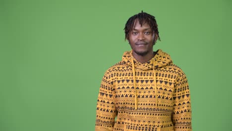 young handsome african man showing something