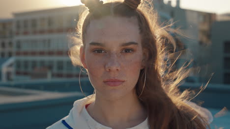 portrait-redhead-woman-with-freckles-looking-serious-with-wind-blowing-hair-teenage-girl-in-city-at-sunset-self-image-testimonial-concept