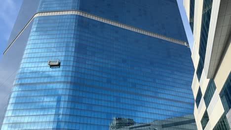 High-Rise-Window-Cleaners-Suspended-On-A-Platform