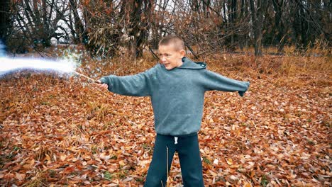 A-young-boy-wizard-casts-a-spell-with-a-magic-wand-at-an-unseen-adversary-in-the-dark-woods