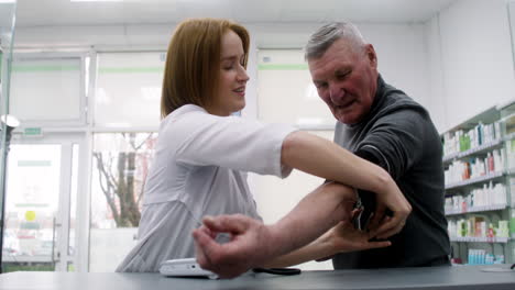 pharmacist checking blood pressure