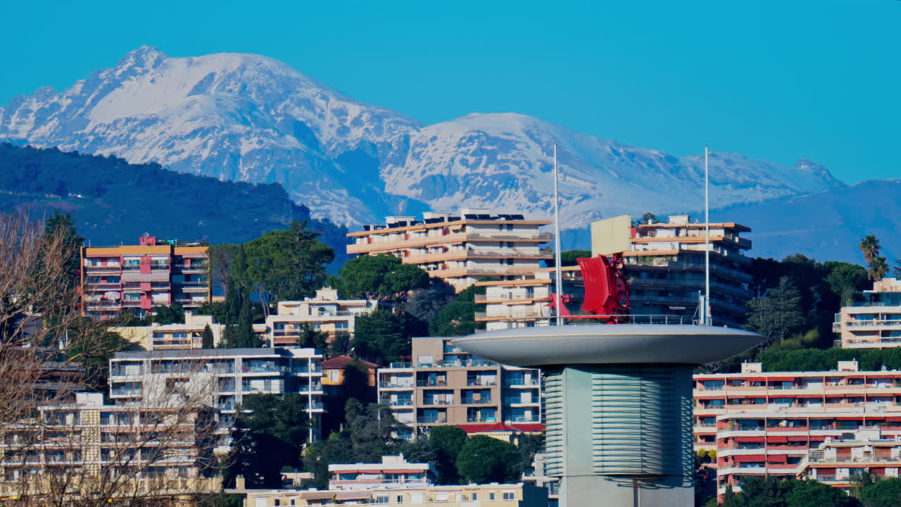 View of the radar antenna at Nice airport, France, mountains in the background