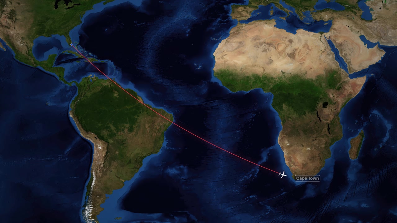 A digital airplane icon follows a red line across the Atlantic Ocean on world map