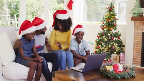 African-american-family-having-a-videocall-on-laptop