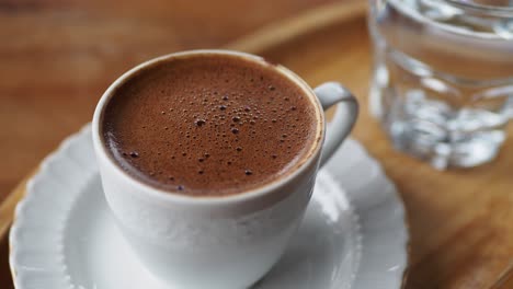 a cup of turkish coffee on table outdoor ,