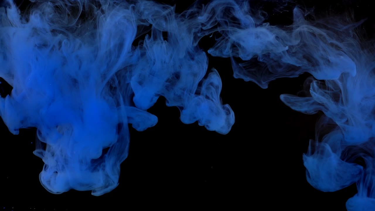 Forme astratte. Riprese su sfondo nero. Mescolanza di colori