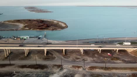 aerial view following jfk memorial causeway connecting north padre island and corpus christi over laguna madre