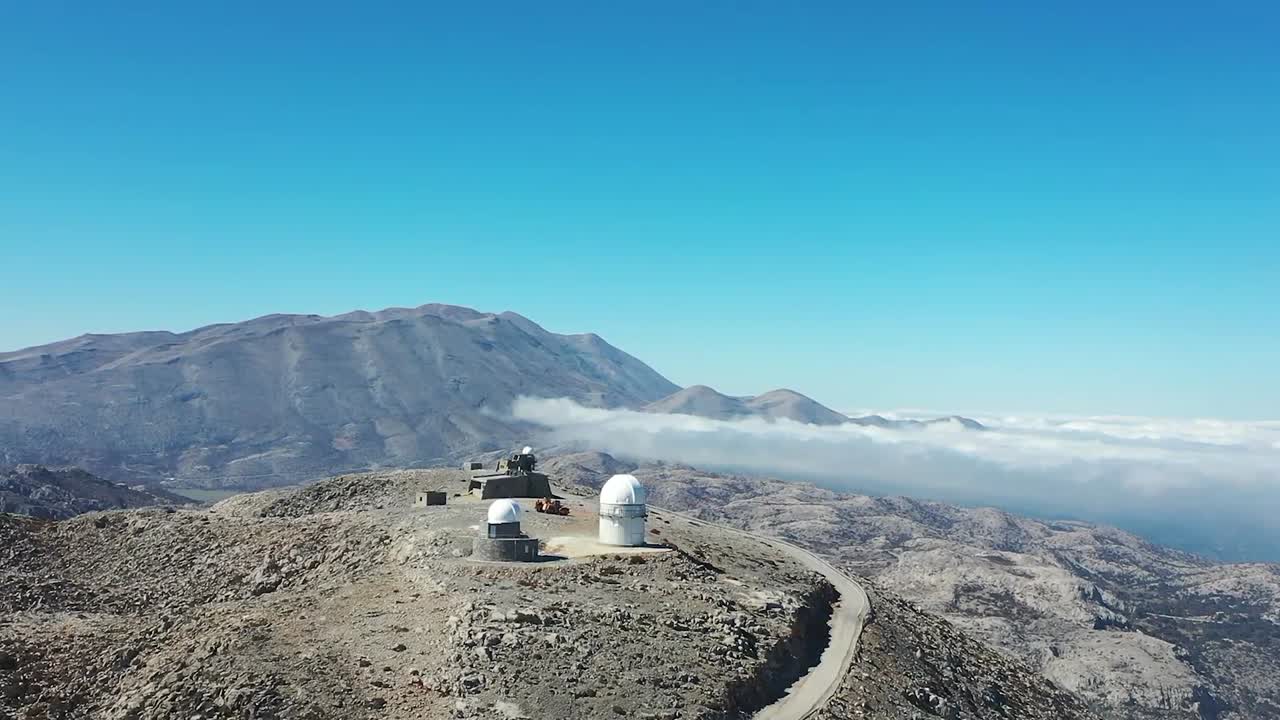 Drone Captures Stunning Views of Mountain Skies and Observatory on Peak