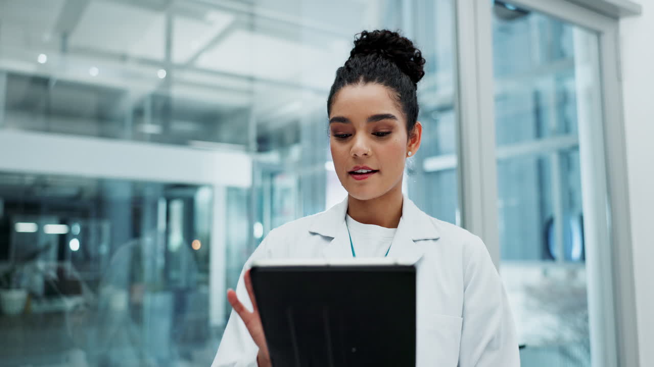 A scientist using a tablet in a modern laboratory