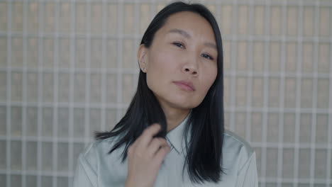 woman in light-green shirt portrait in modern interior
